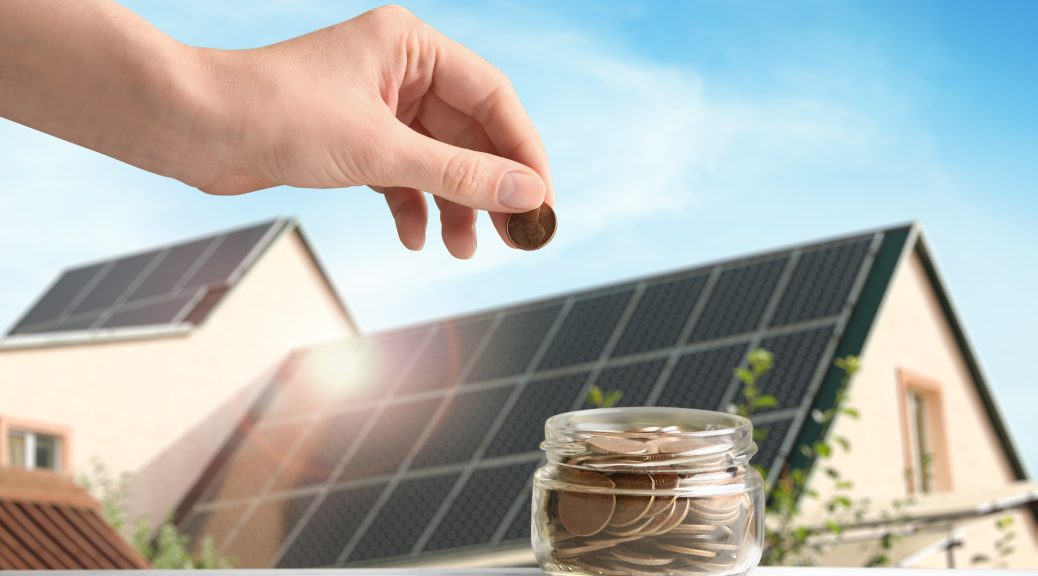 Woman putting coin into jar against house with installed solar p